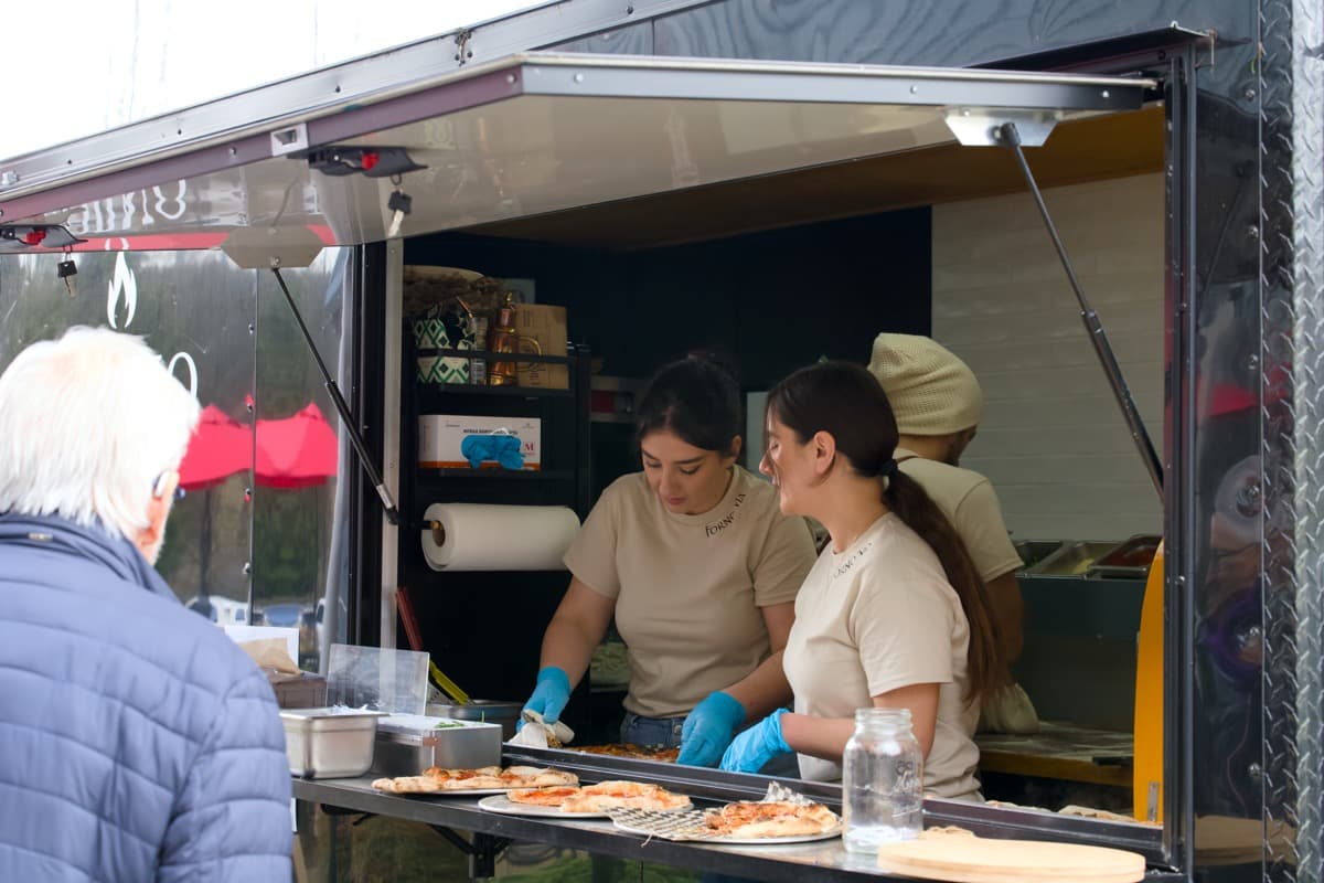 Forno Via catering a corporate event with live wood-fired pizza service in Seattle