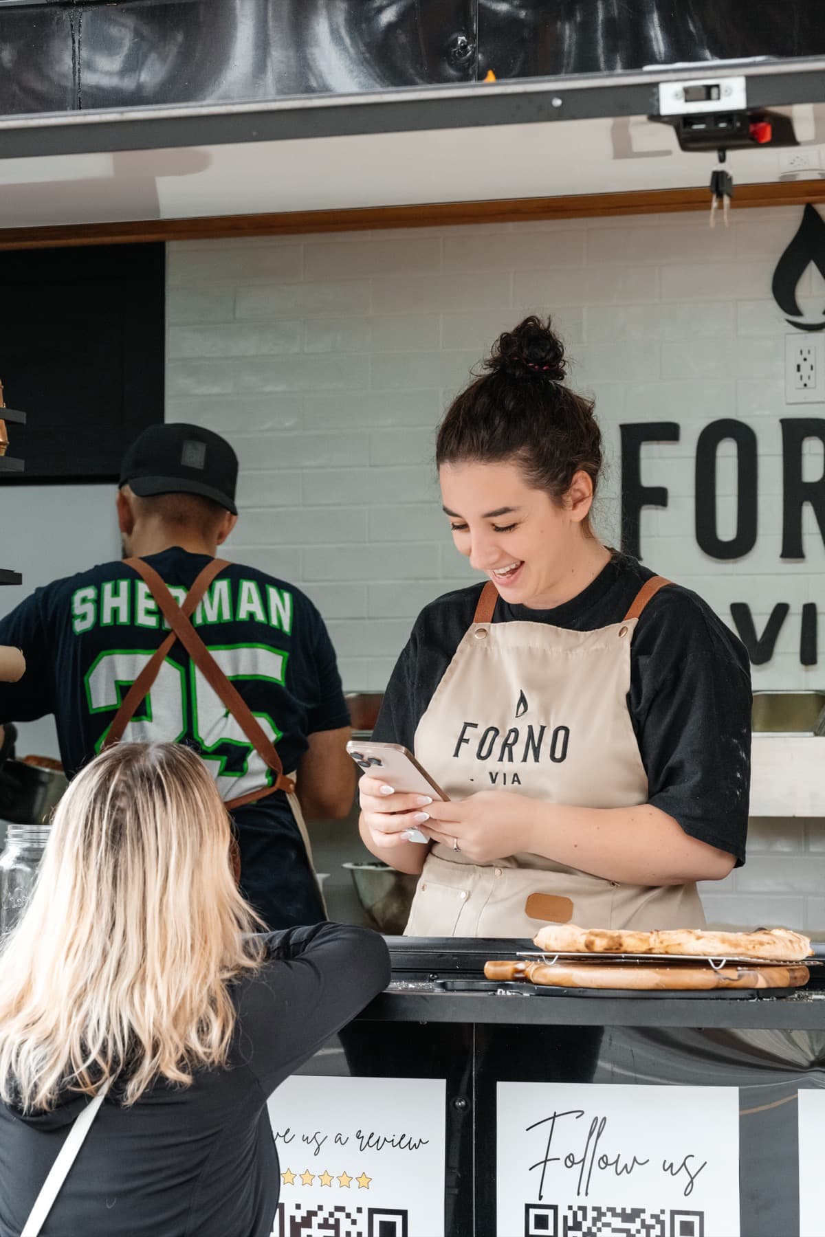 Forno Via mobile pizza catering trailer set up at a Seattle event venue