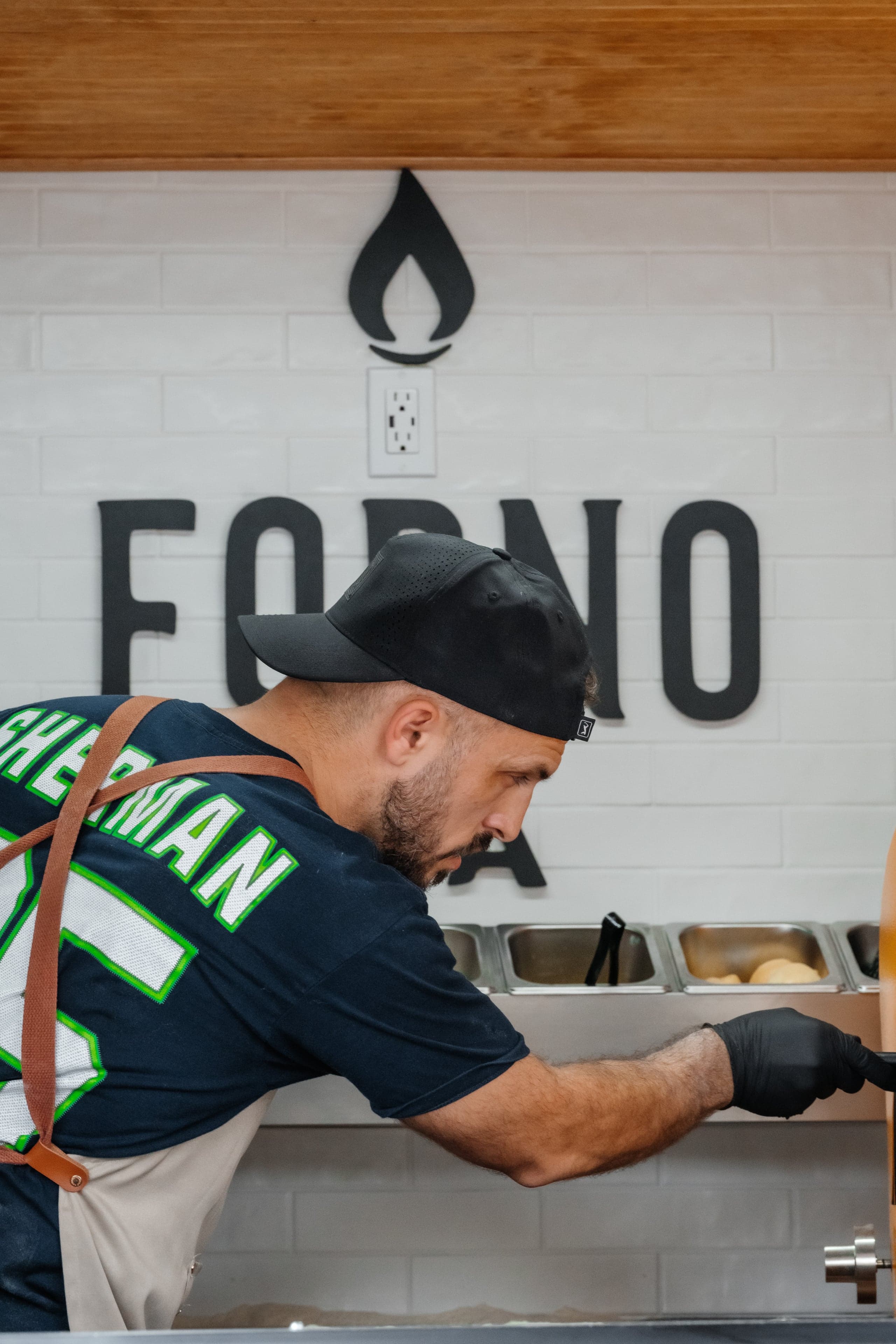 Corporate team building pizza making class with Forno Via chef in Seattle